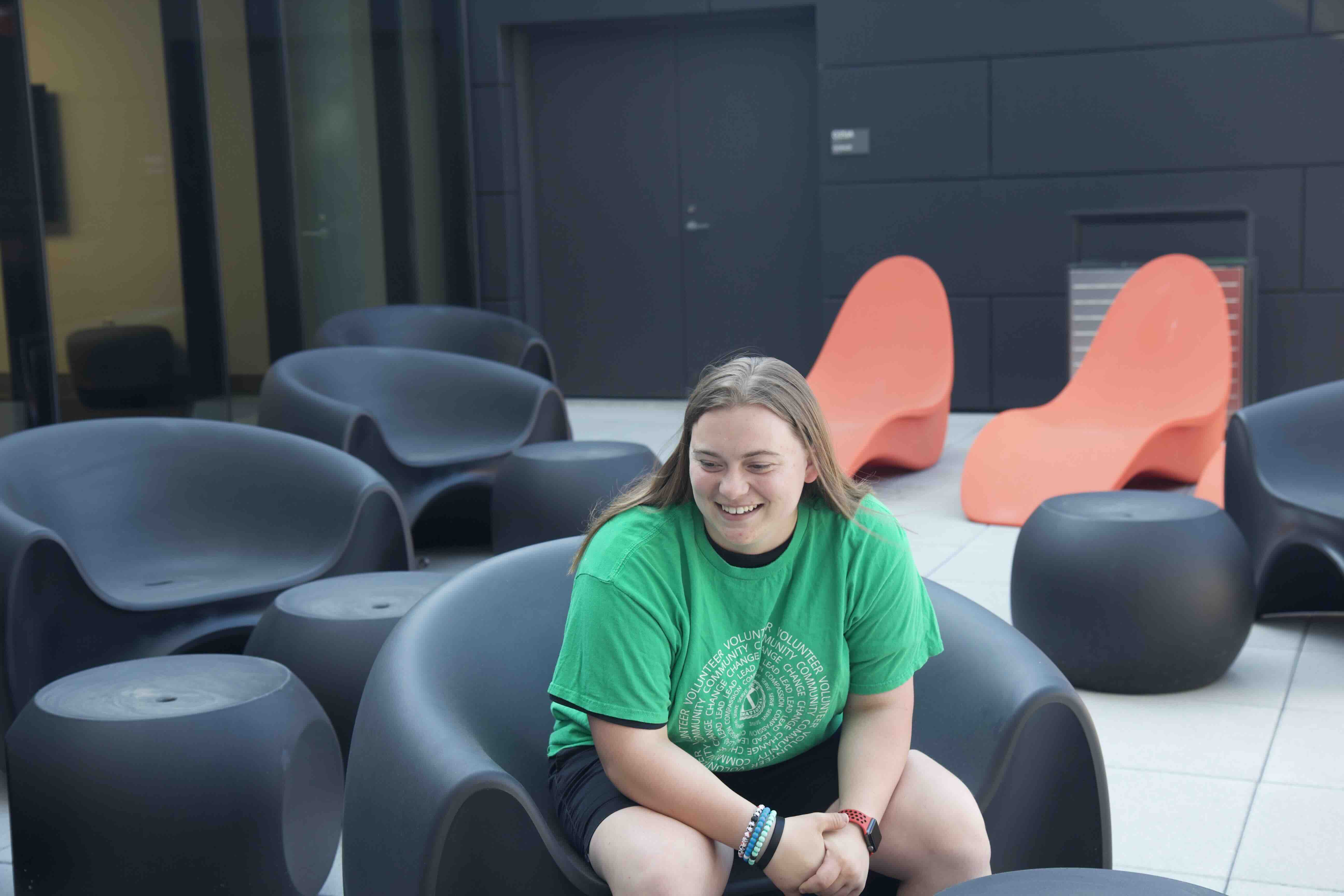 Marget sitting in a chair