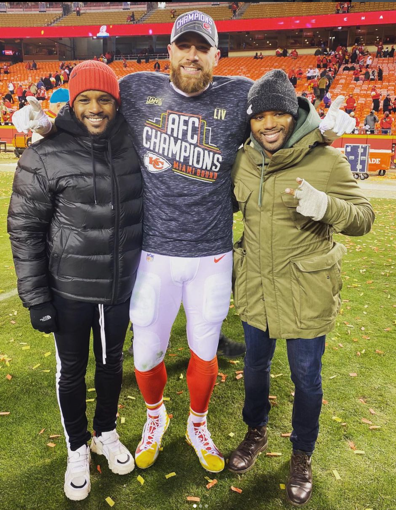 André Eanes (left), Travis Kelce (center) and Aaron Eanes (right) standing together after the Kansas City Chiefs' AFC Championship win in 2020.