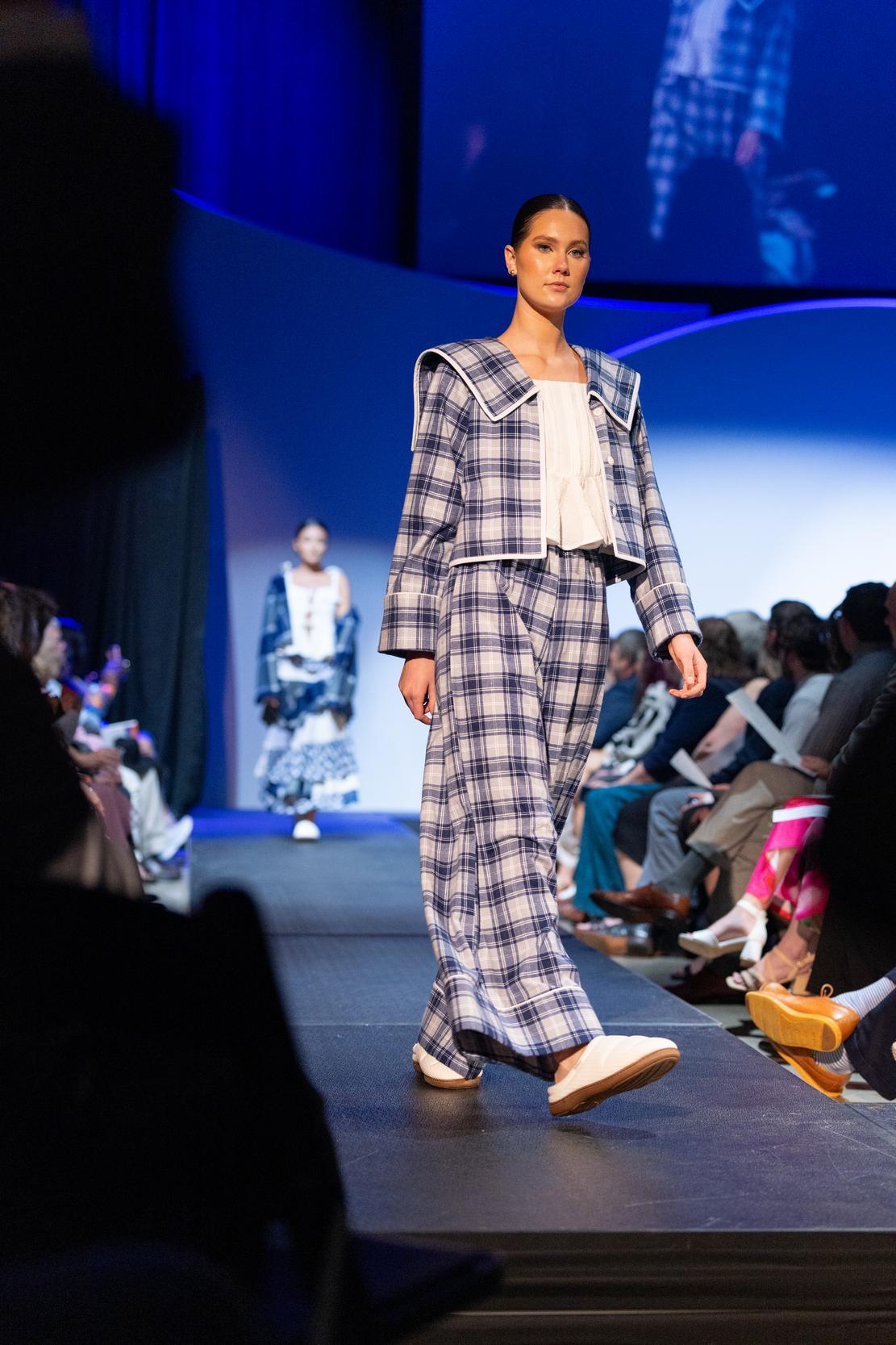 model wearing a blue and white check pansuit  