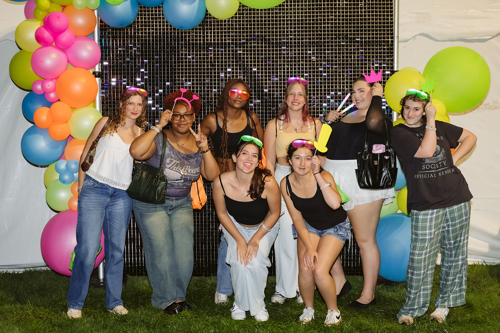 UC students pose at photo booth