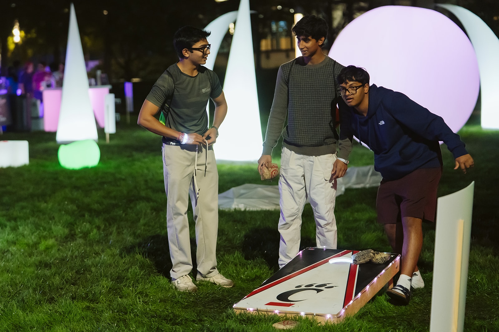 UC students play LED corn hole