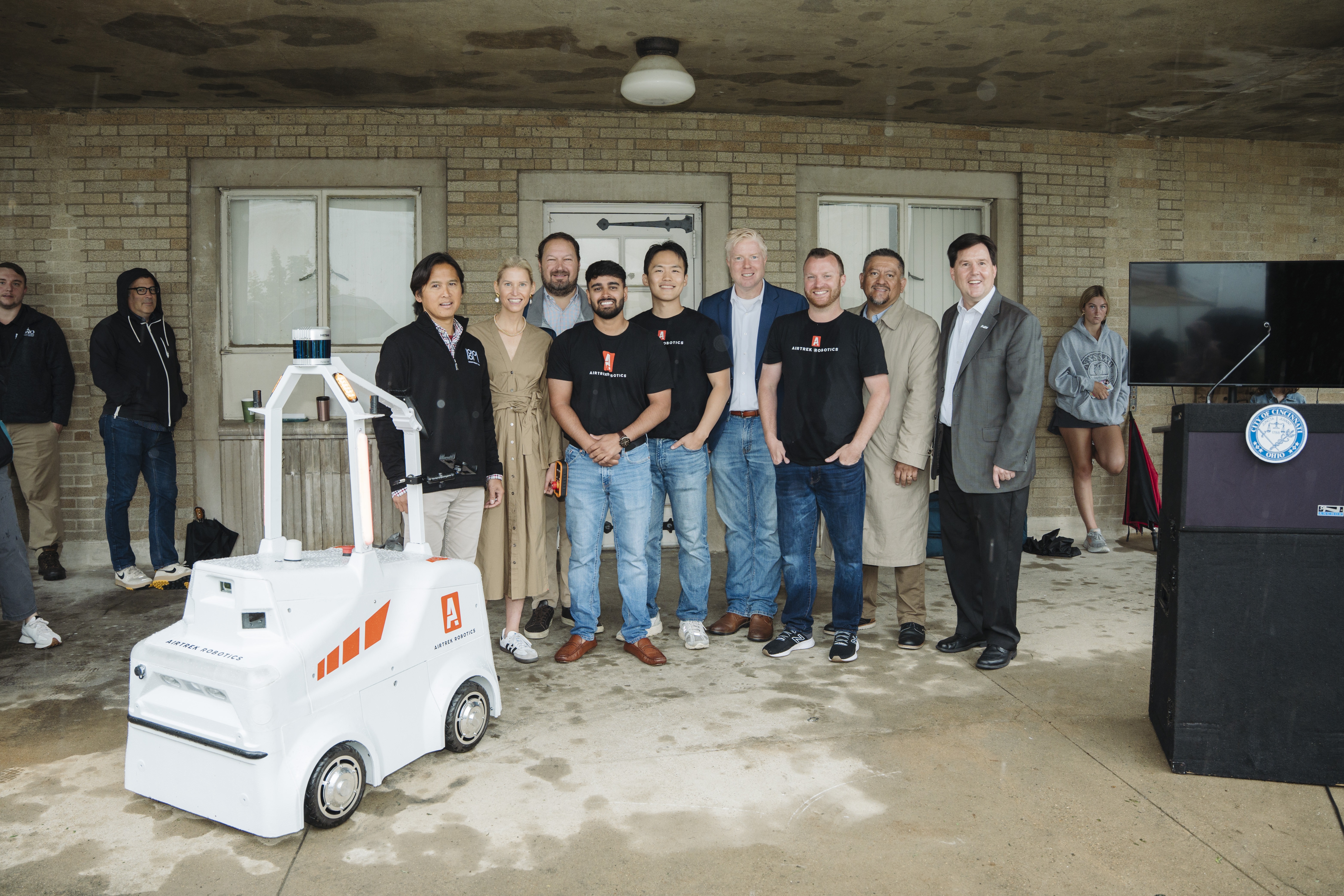 Councilmember Mark Jeffreys stands with Airtrek Team and guests.