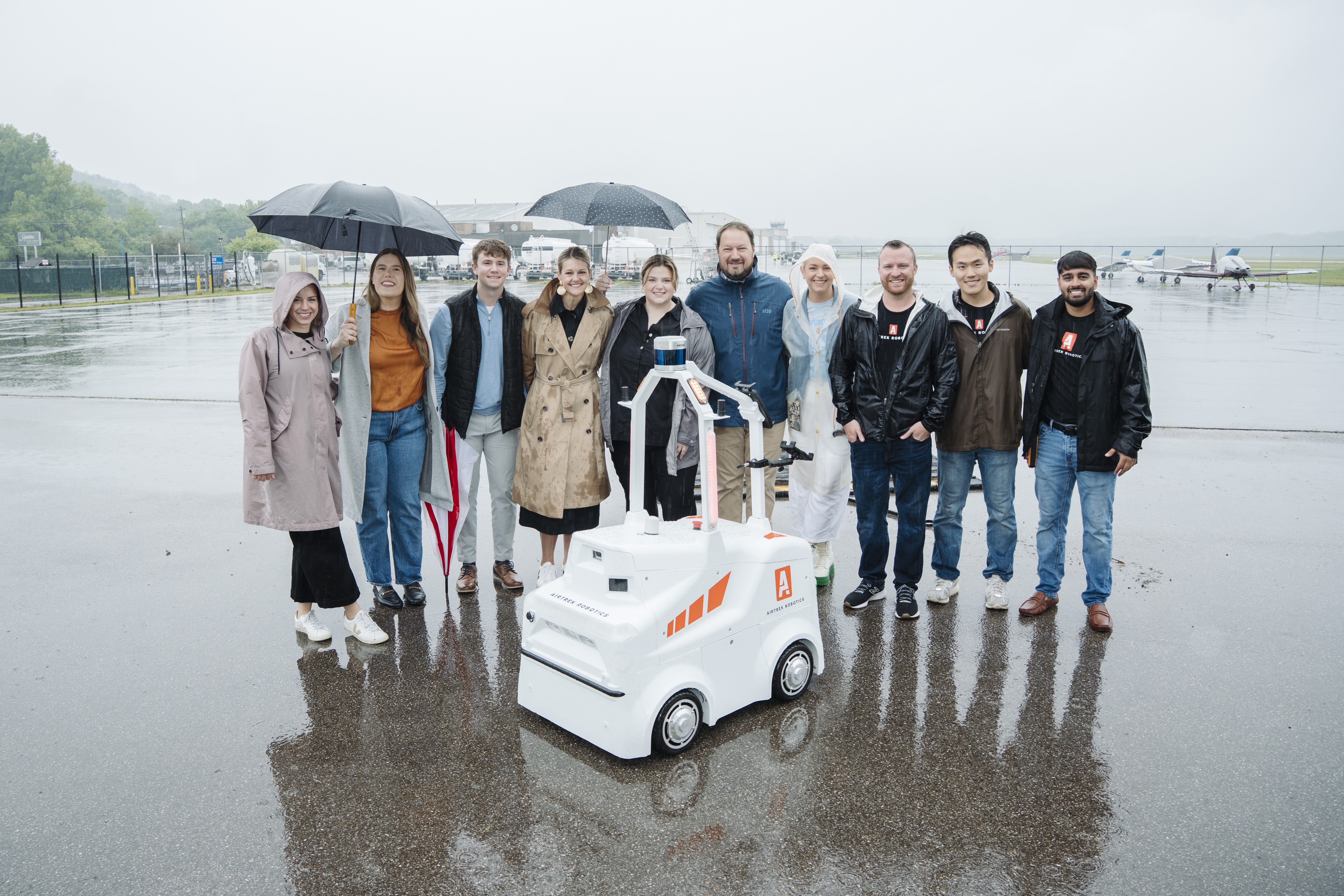 Cintrufuse employess and CEO, J.B. Kropp stand with Airtrek Team.