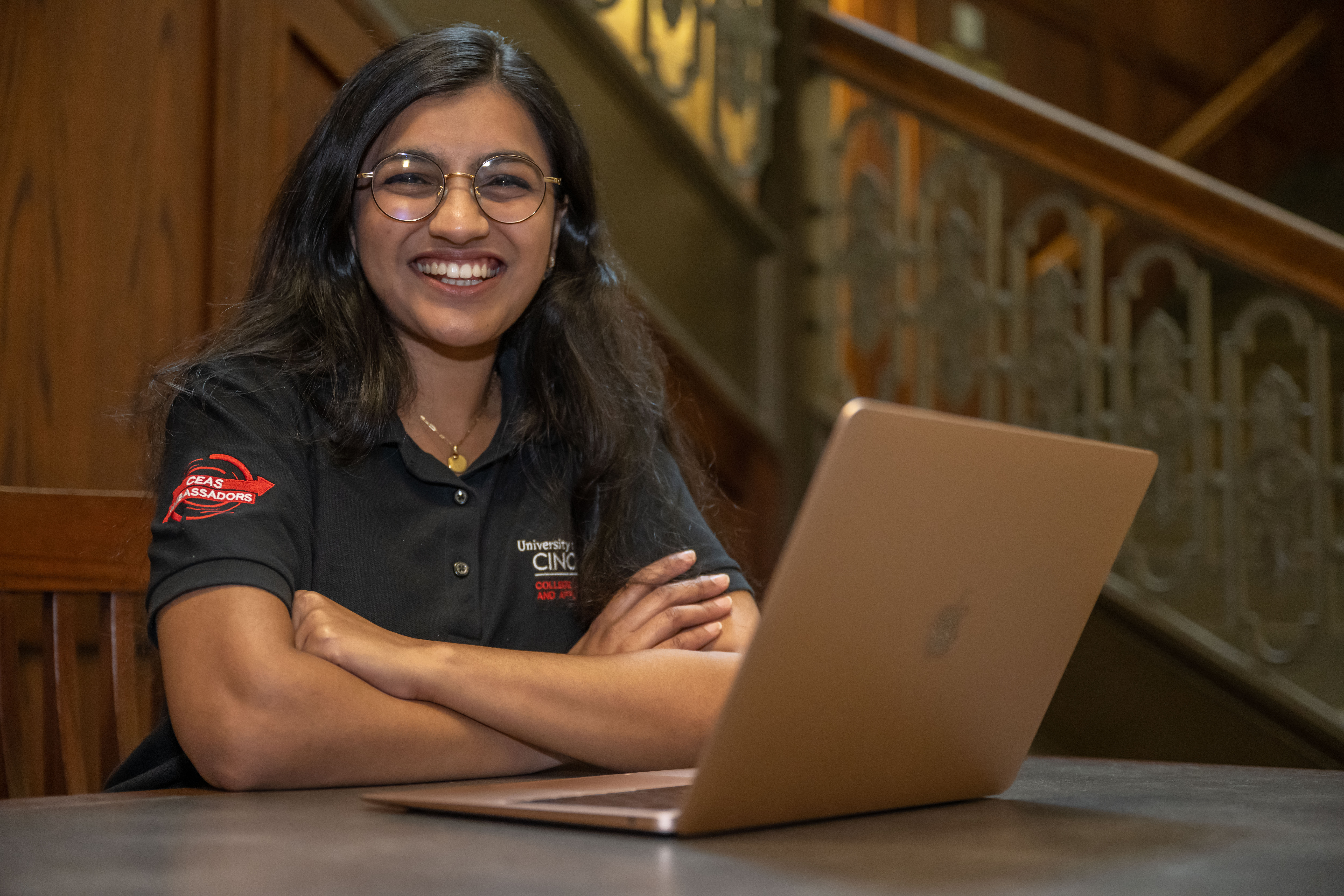 Anusha Chitranshi sitting in front of a laptop.