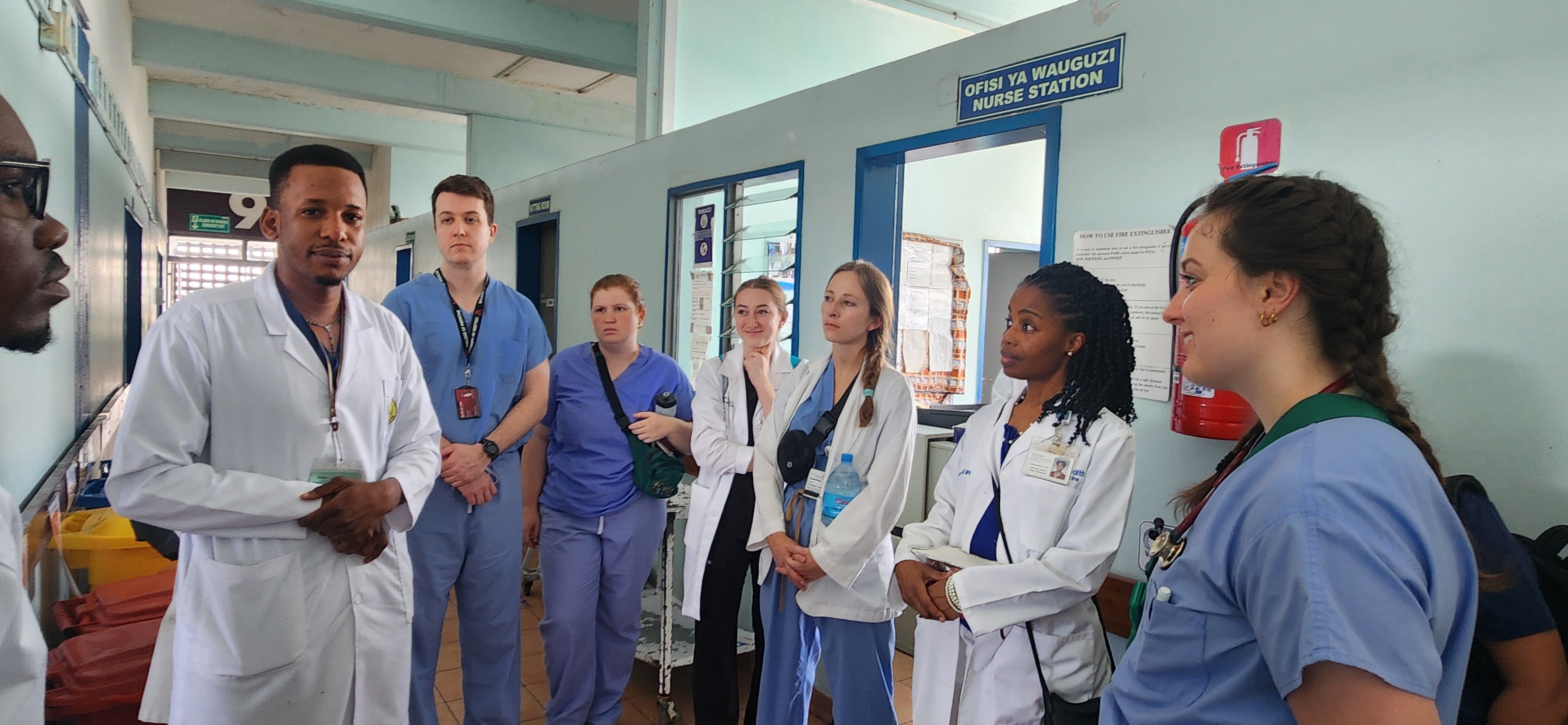 Village Life UC student delegation rounding with clinicians of Catholic University of Health and Allied Sciences. Photo/Village Life