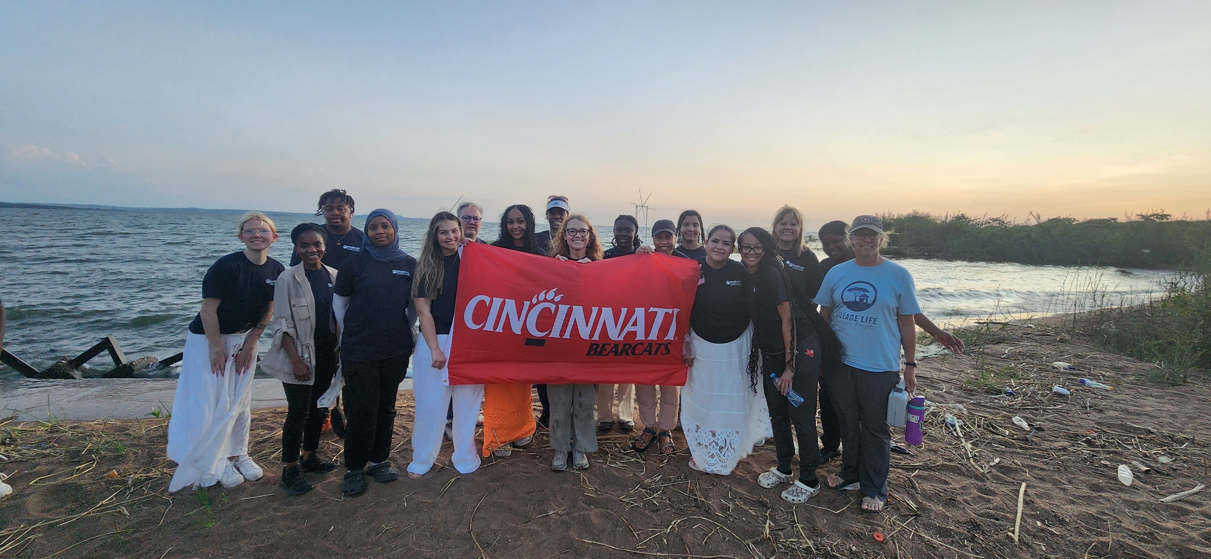 UC Blue Ash, Beth Monnin (far right) with Warren Bennis Leadership Institute Academic Director, Donna Chrobot-Mason (center) stand with project coordinators. Photo/ Village Life