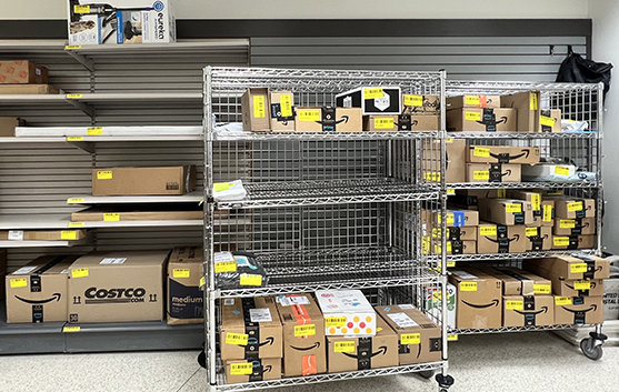 Packages stacked on shelves in package center