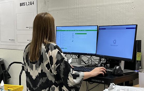 Female worker processes packages in the package center work area