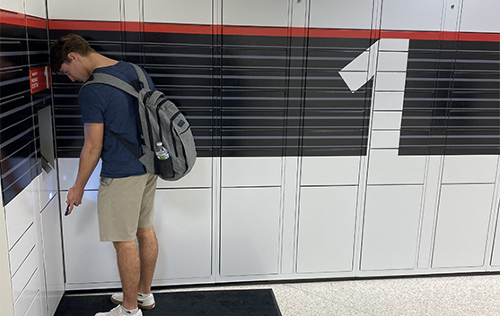 Student scans device to open locker