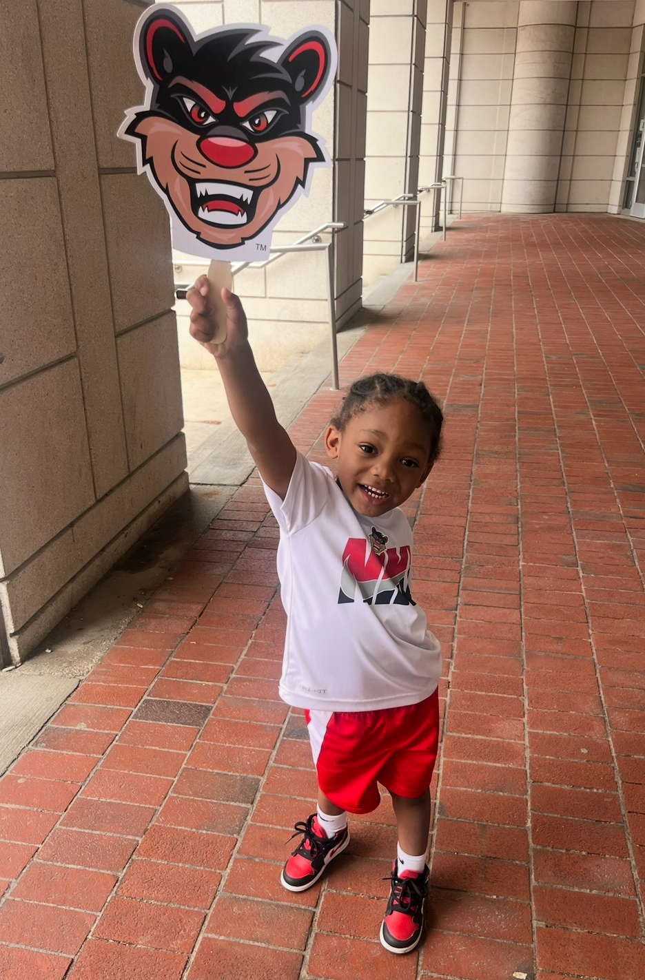 Armani holding a Bearcat cutout