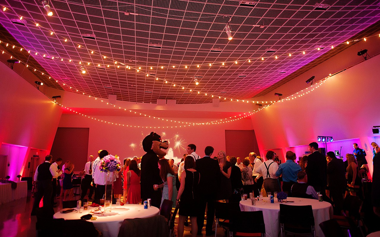 UC Bearcat Mascot greets wedding guests at a reception in Great Hall.