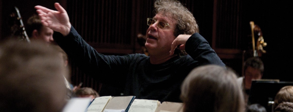 Randy Edelman conducts at a rehearsal