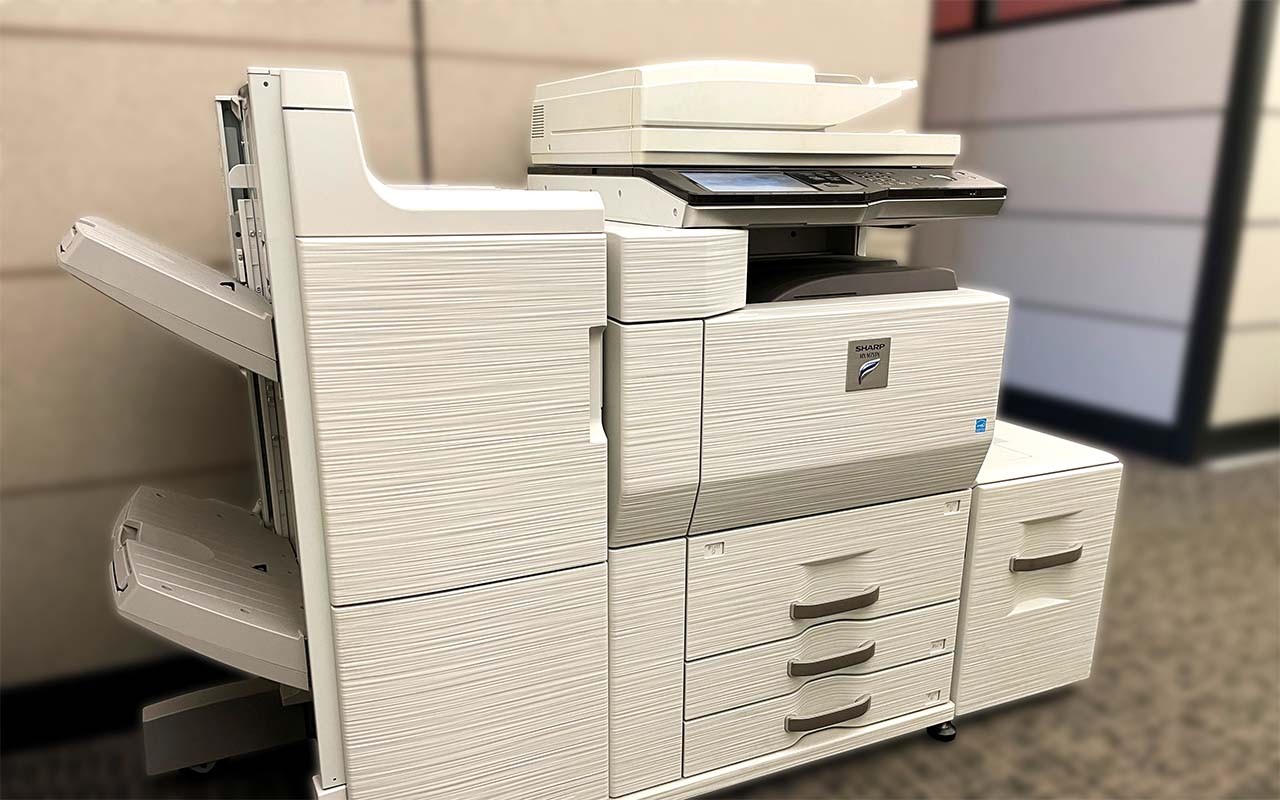 A tan copy machine example of a rental