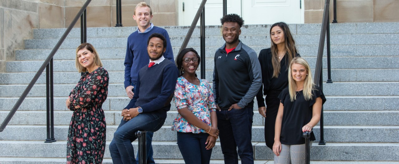 UC students standing outside building