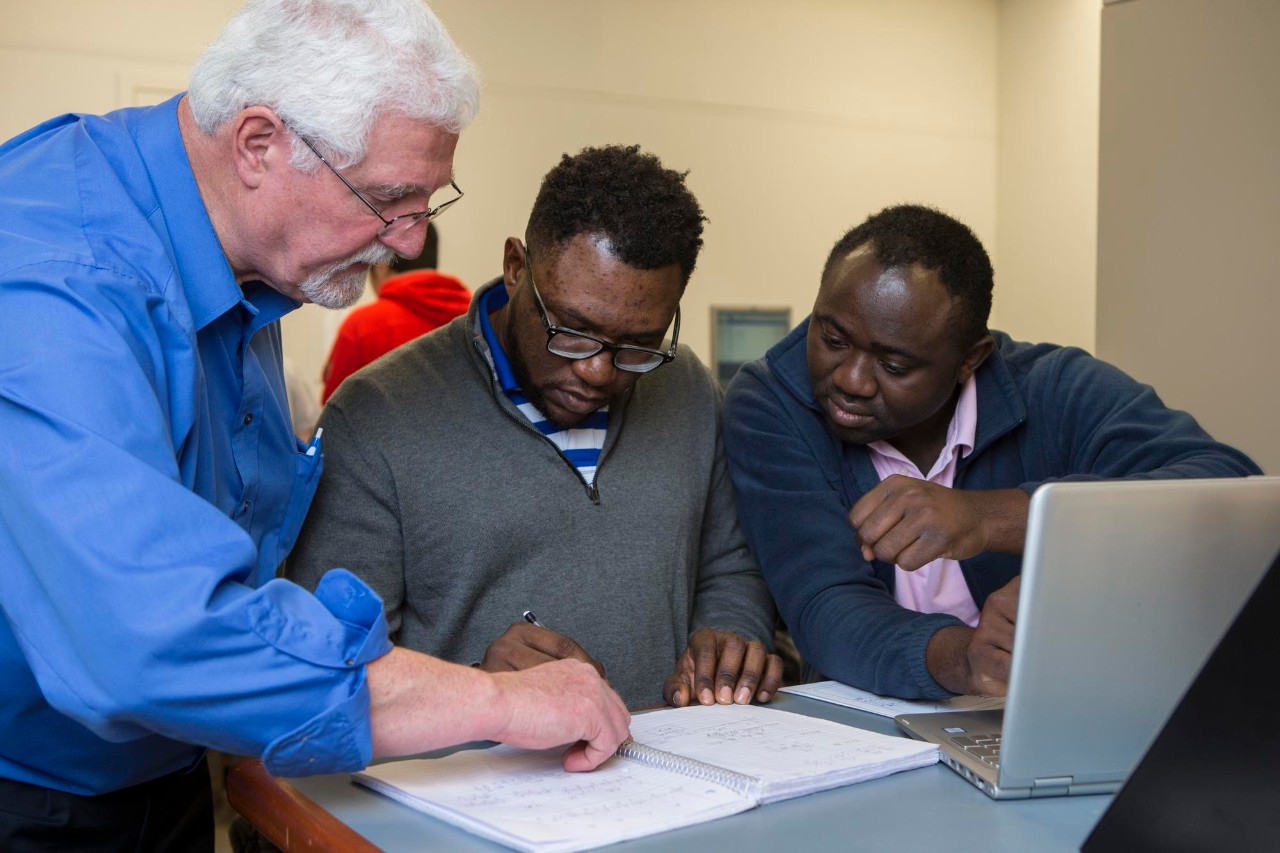 students are assisted by a professor
