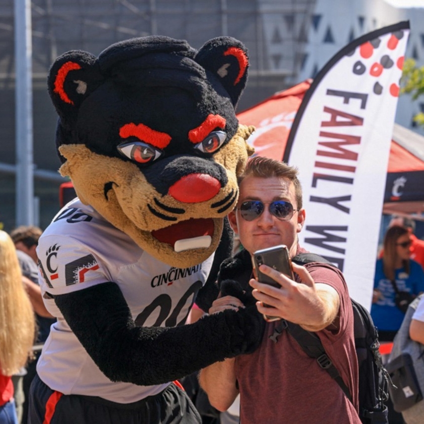 A student poses with the Bearcat