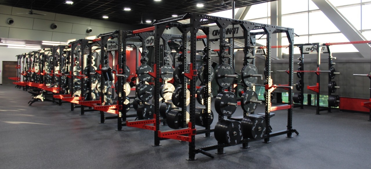 Rendering of new black squat racks with red accents.