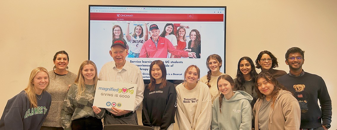 Students in class posing with Roger Grein, founder of Magnified Giving