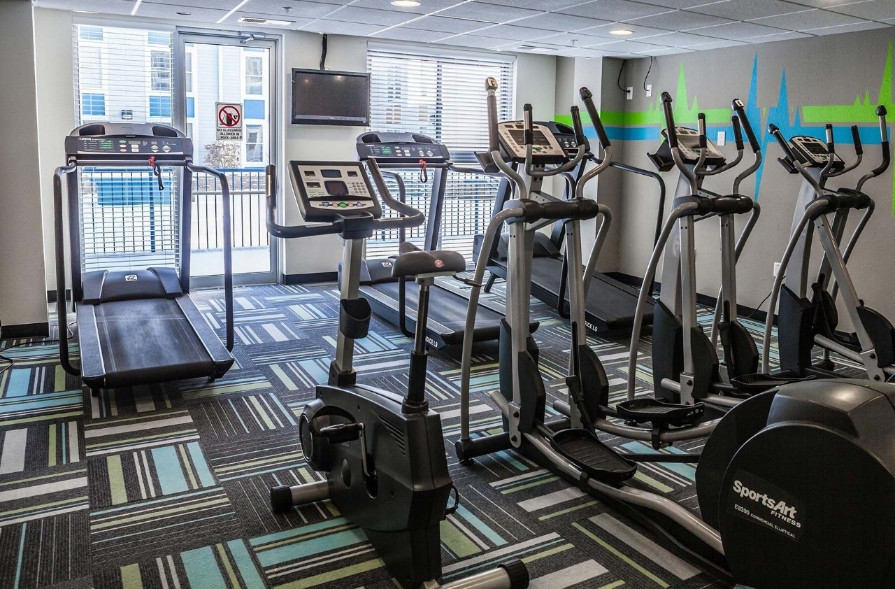 Common area room featuring cardio machines.