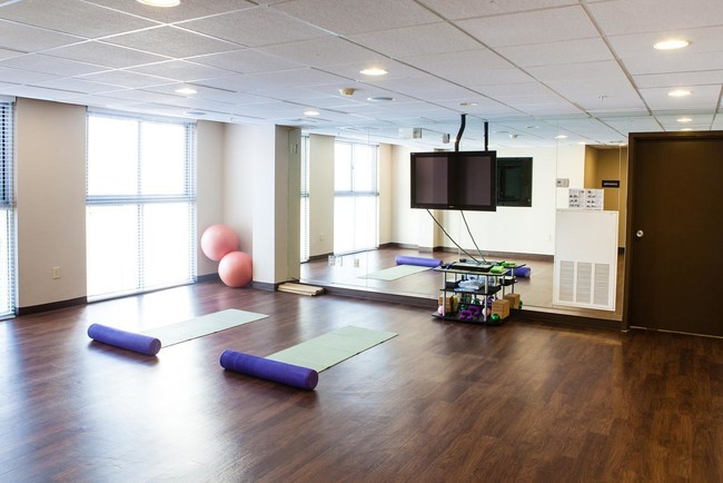 Common area room with yoga mats and balance balls.