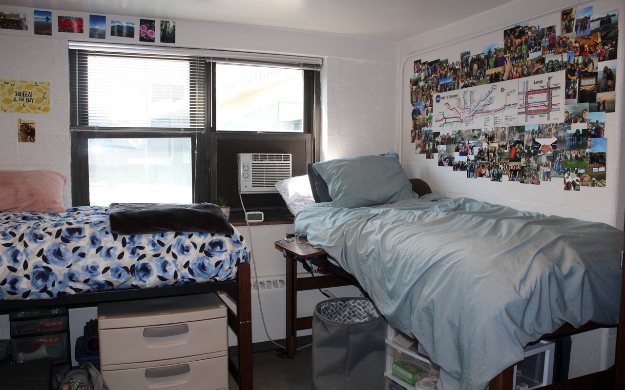 Two beds and a window in a double room in Dabney Hall.