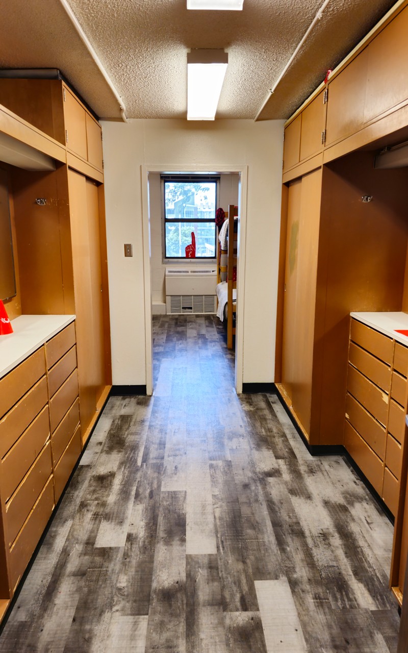 Daniels entry with wardrobes, storage and dressers on both sides, bunk bed in background