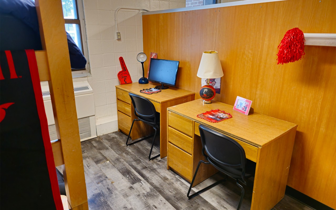 two desks with chairs side by side