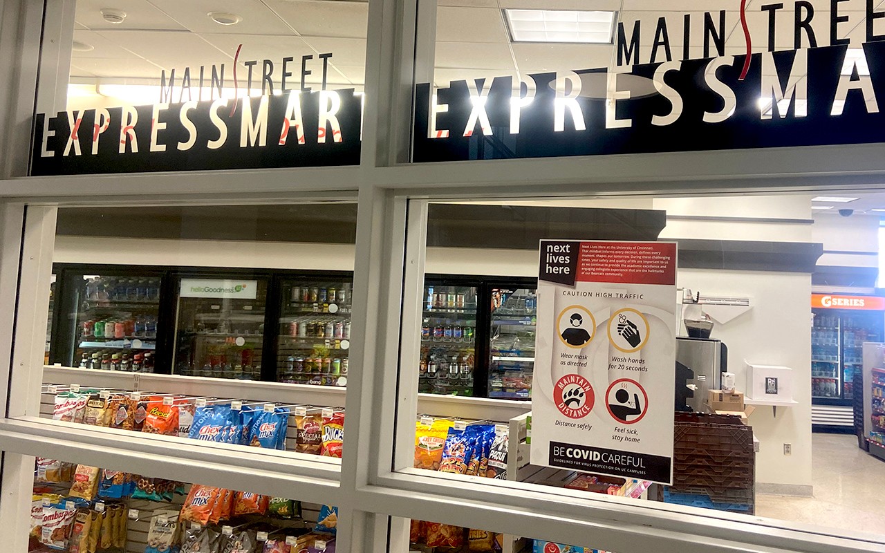 View through windows of ExpressMart store showing snacks and beverages on display