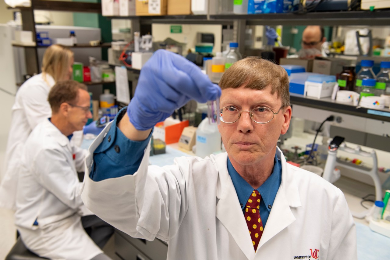 Andrew Norman, PhD, working in his lab with team.