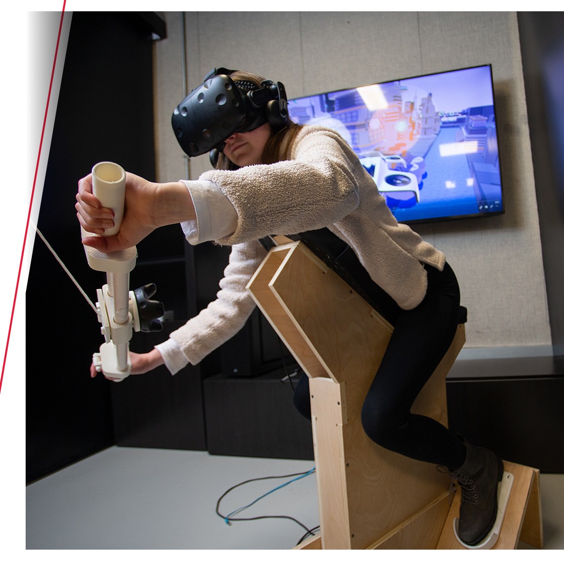 Student operates a virtual-reality motorcycle