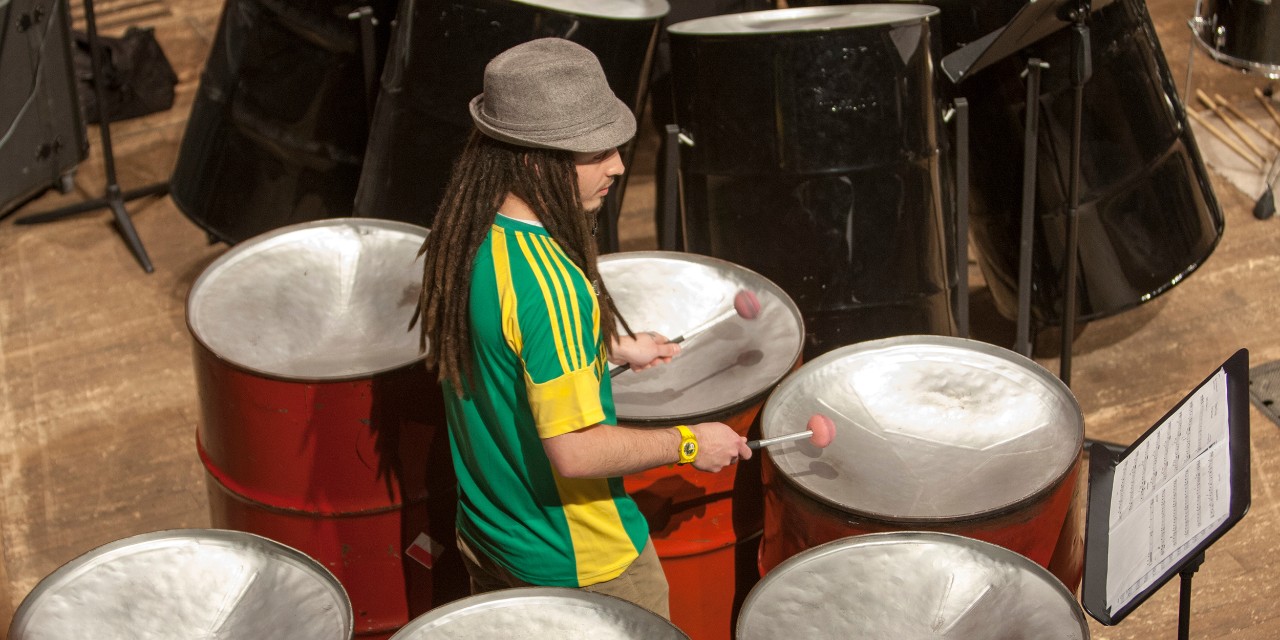 CCM Steel Drum Band performs on stage at Corbett Auditorium. 