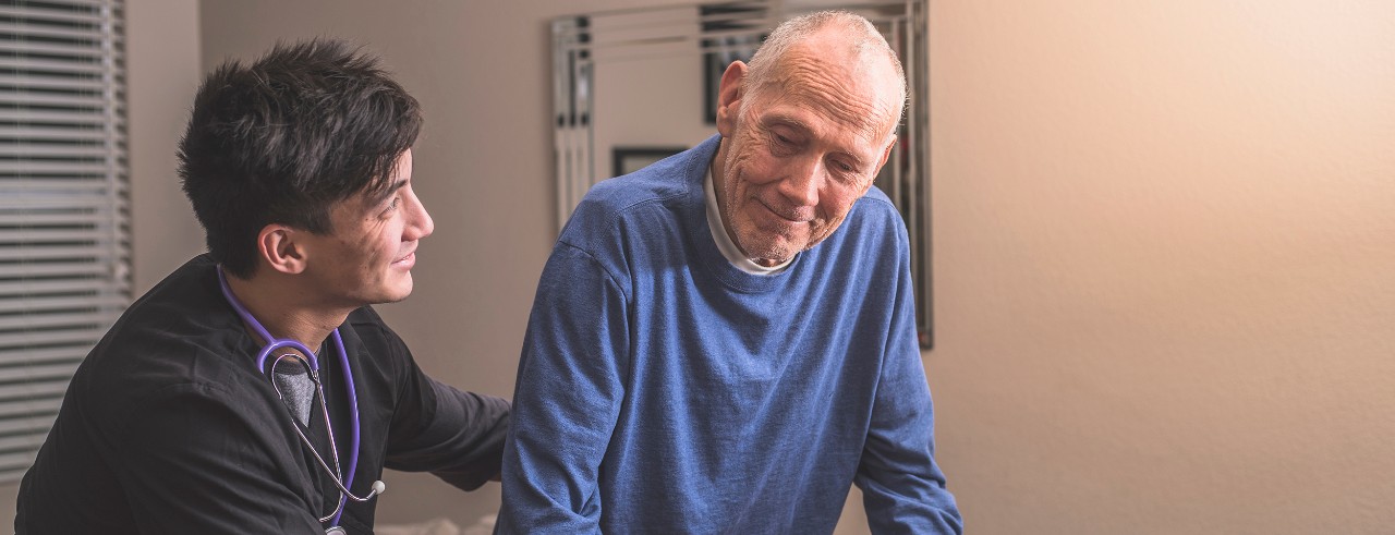 Stock image of physician with older resident