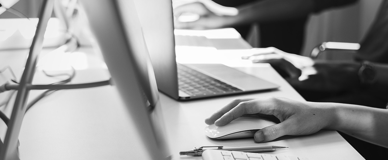 hands typing on computer keyboard