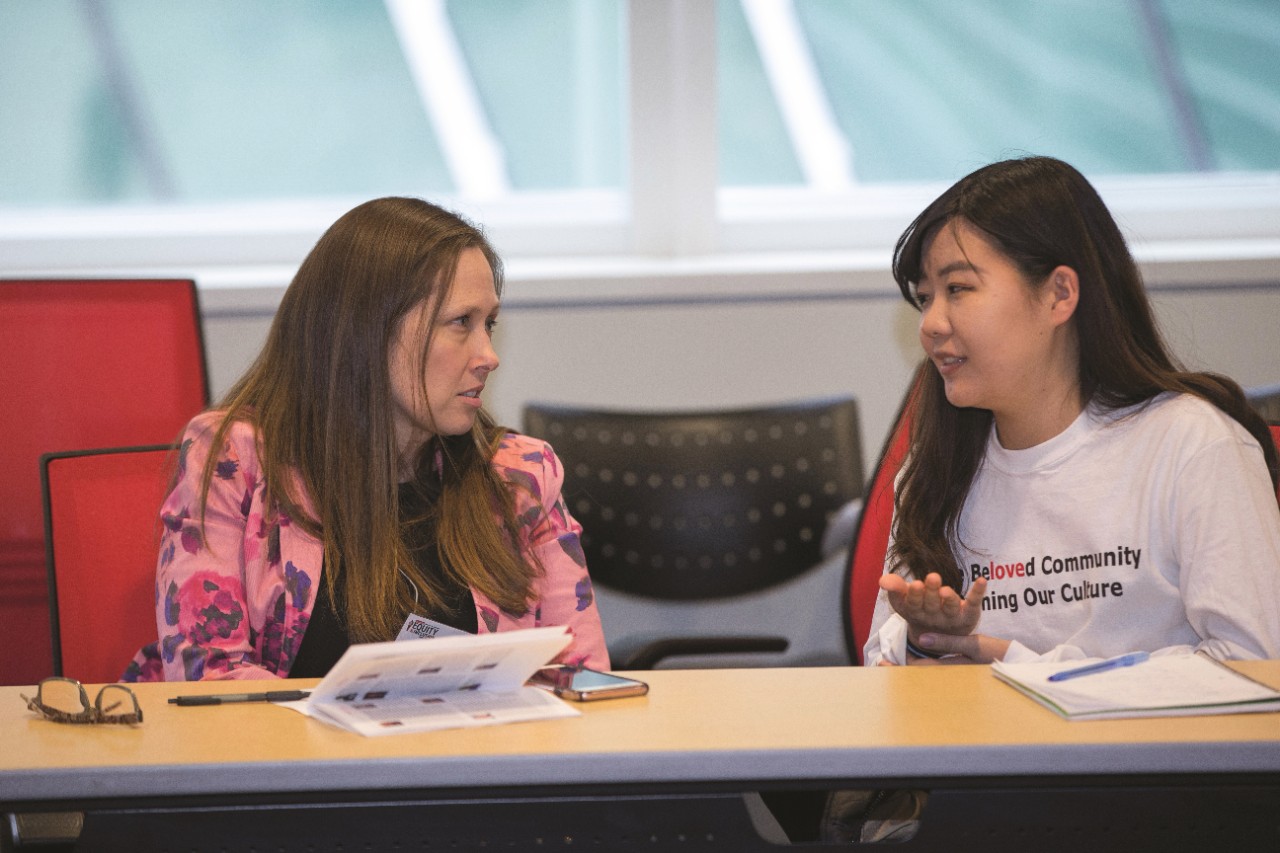 Picture of two attendees at the Equity & Inclusion Conference