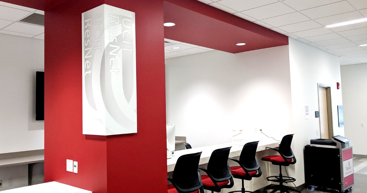 Empty chairs sit in a tidy row along a counter in the new ResNet computer lab in University Hall