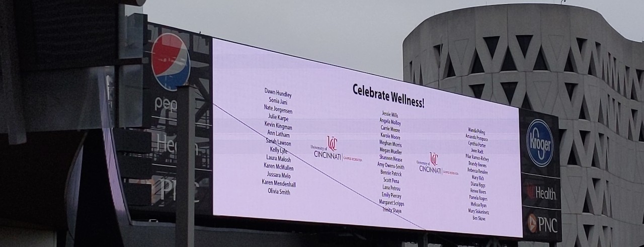 Scoreboard inside Nippert Stadium shows UC people nominated as #HealthyUC