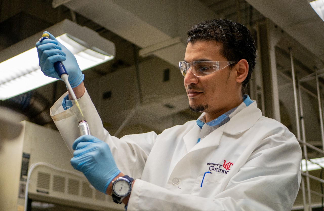 Wael injects water into vial