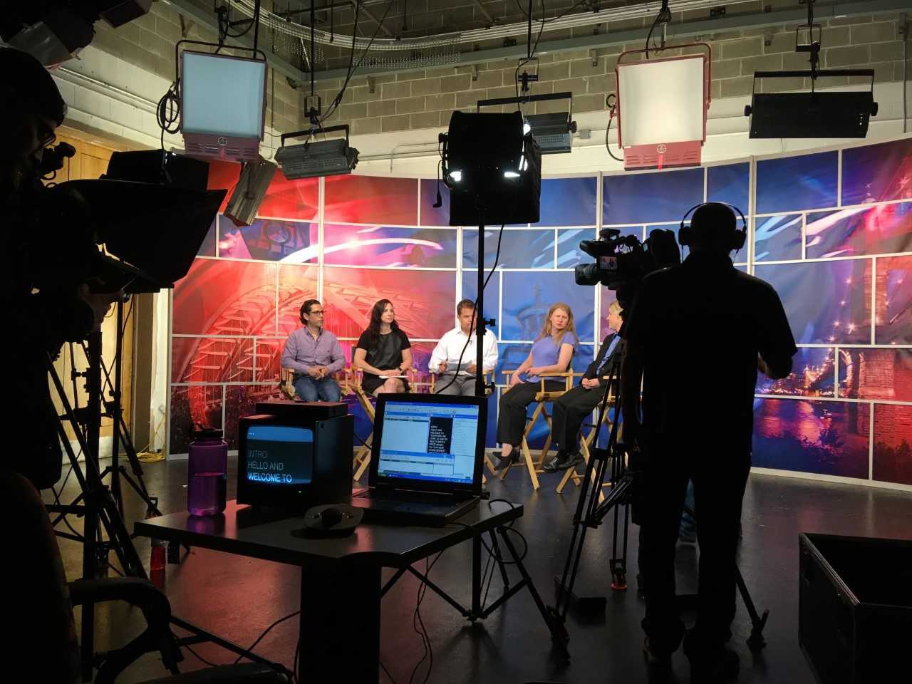 UC faculty take part in a panel discussion in a WKRC-Local 12 TV studio.