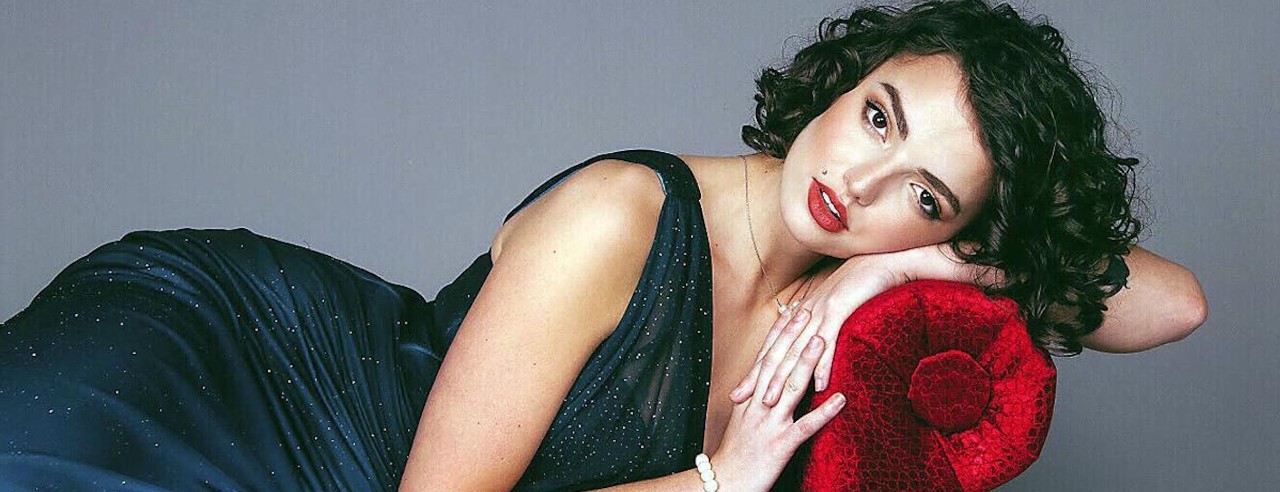 Woman lays on a chaise lounge