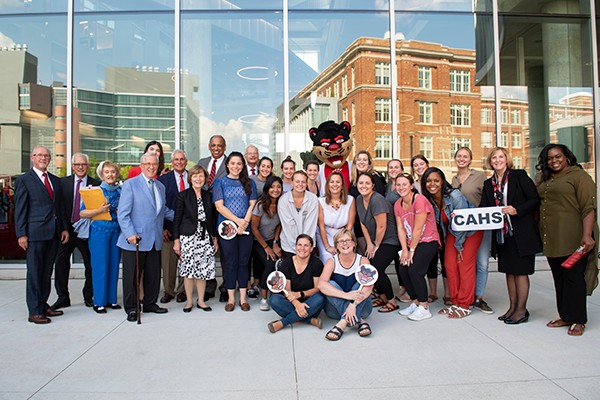 group shot outside the new CAHS building