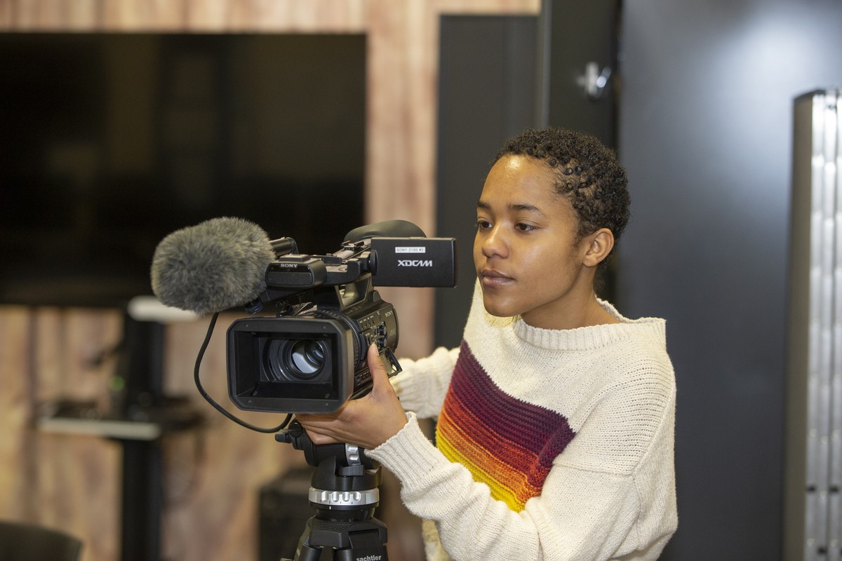 UC student Mary Williams looks though video camera