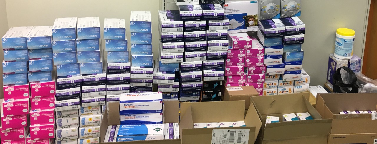 Stacks of gloves and masks for donation