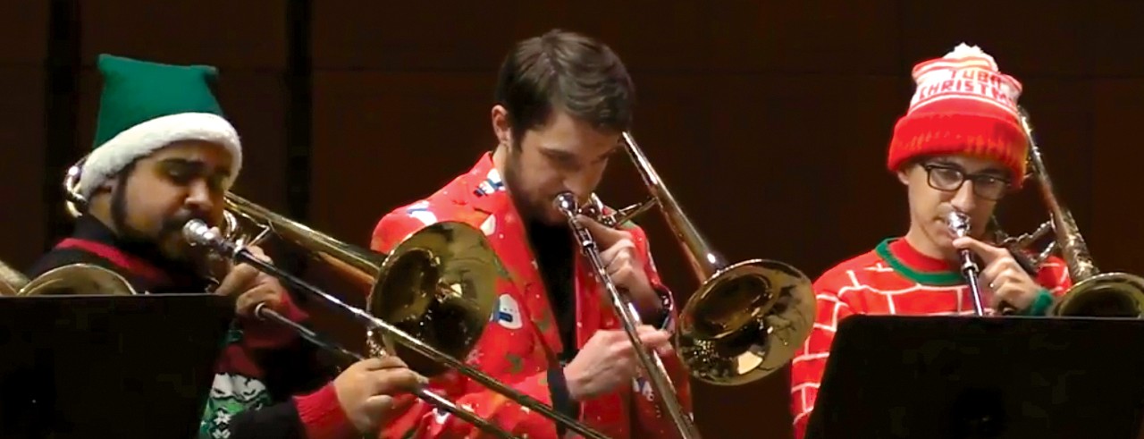 A photo of three CCM students performing during the 2019 Brass Choir Holiday Spectacular.