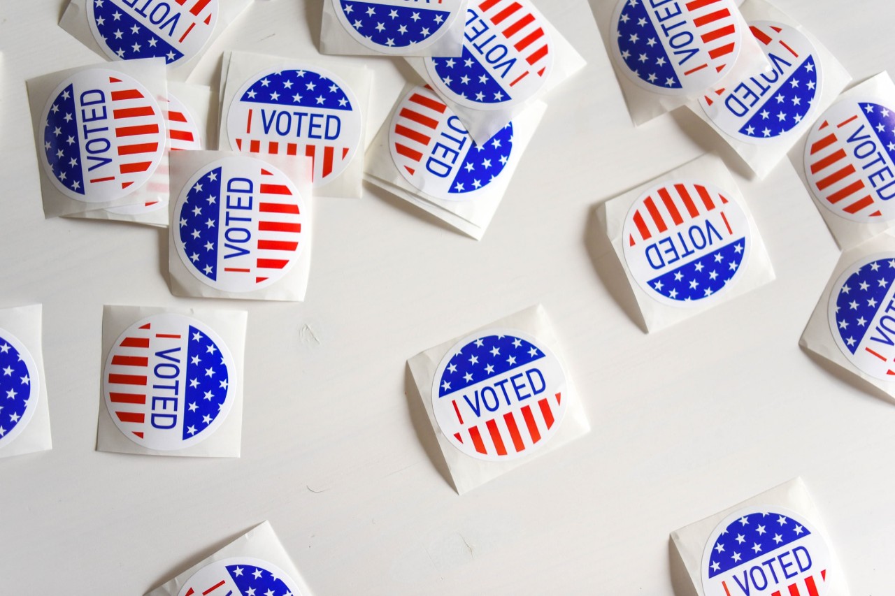 voting stickers laid out on a table