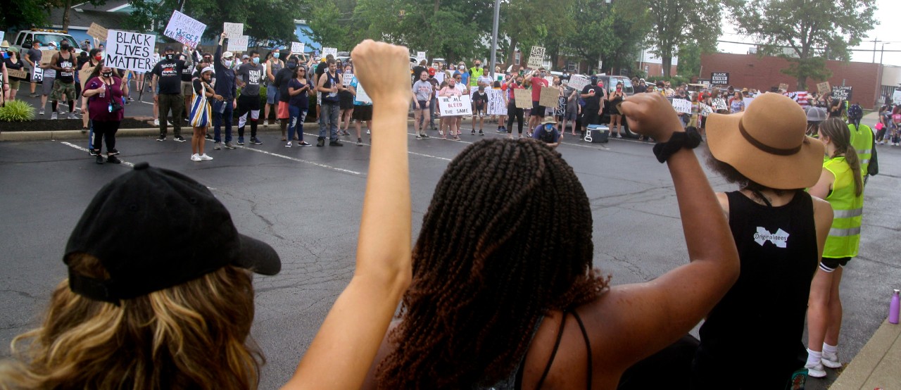 a group of people are gathered for a protest