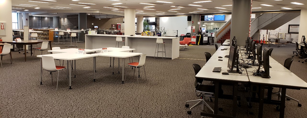 tables and chairs in the library