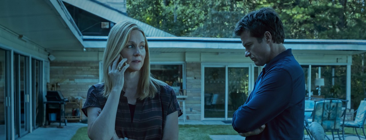 A man and a woman on set at of a TV show