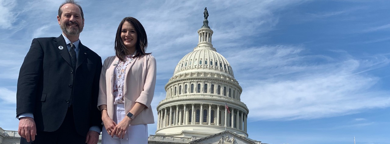 Jennifer Patritti Cram and Dr. Kim Seroogy stand outside the U.S. Capitol