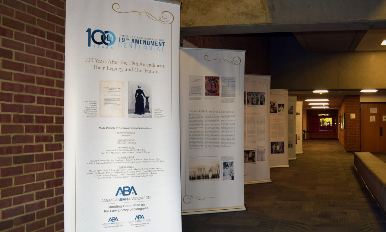 Photo of all six 19th Amendment banners displayed in a hallway.