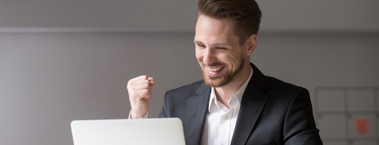 young businessman celebrating a success 
